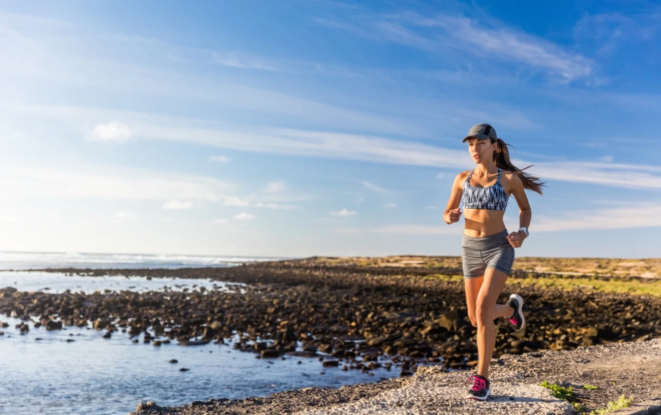 Femail runner running in a cap