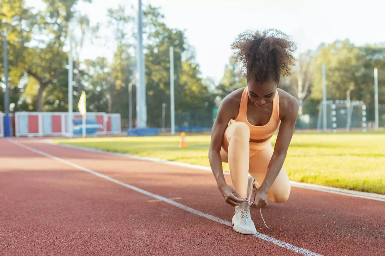 Woman getting ready for training at the stadium