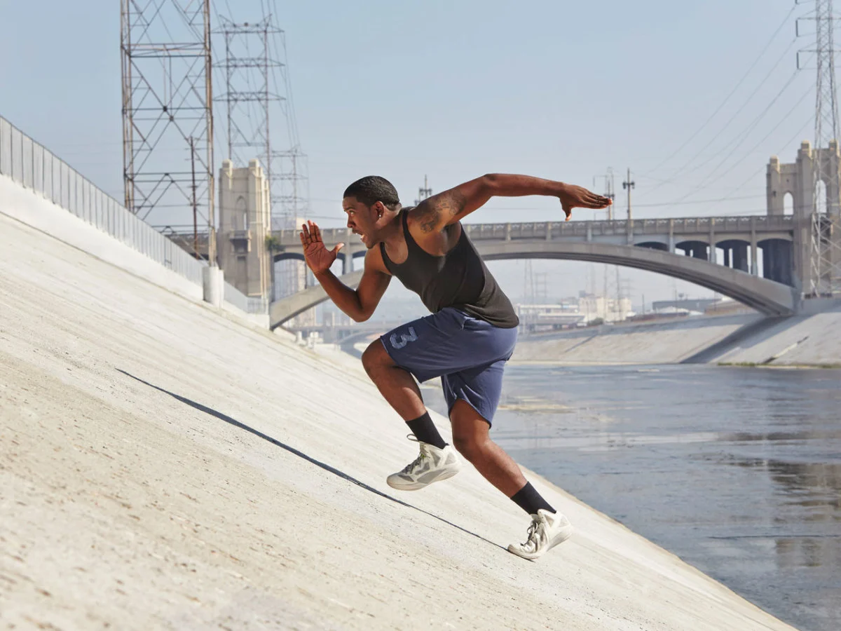 Man running incline sprints