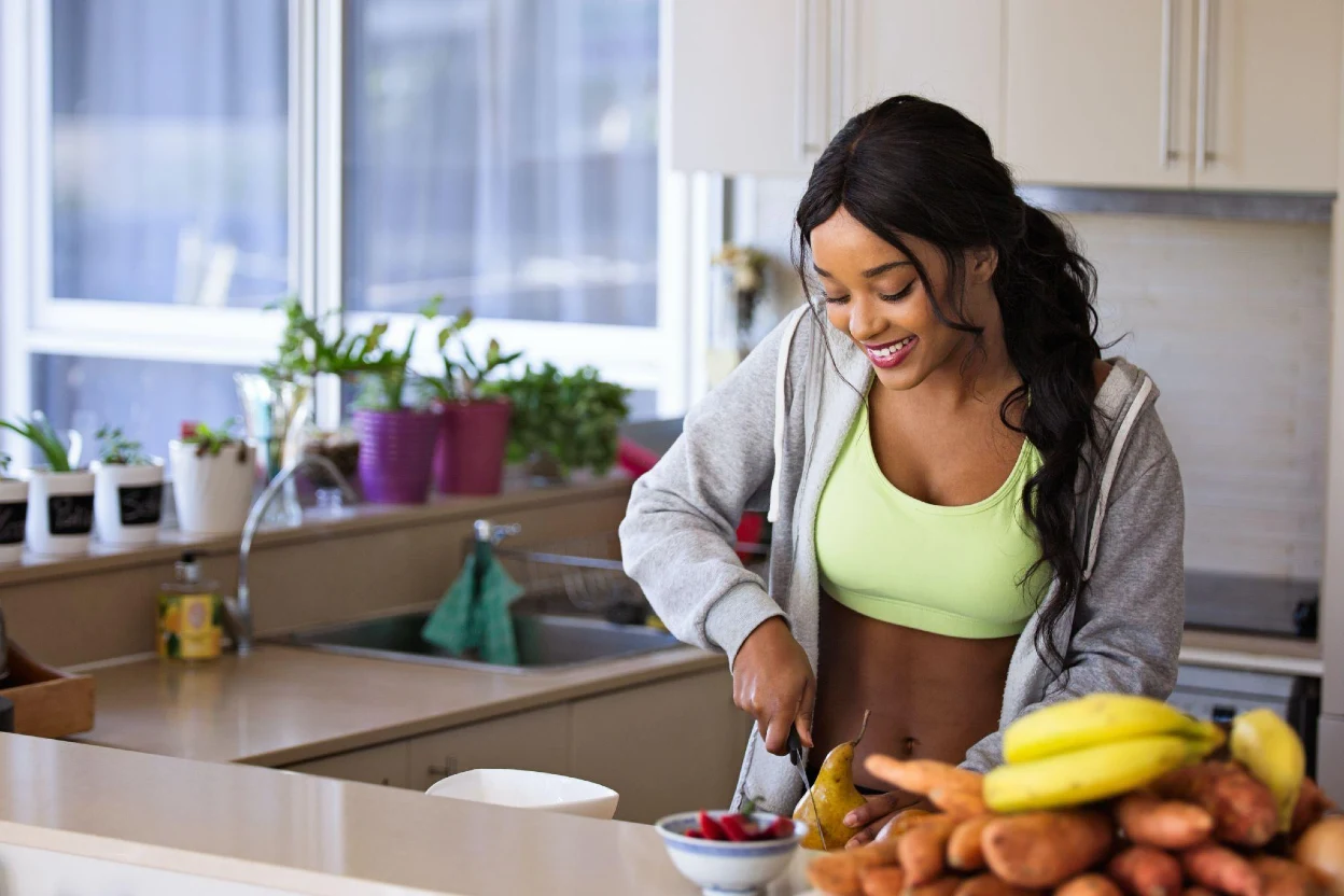 Woman make breakfast before workout run