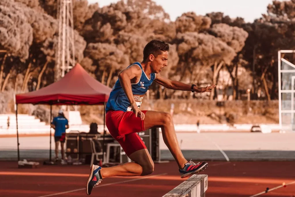 Track speed running with overcoming barriers such as jumping events