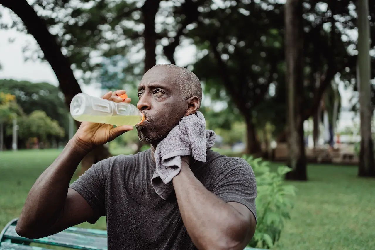 Runner man drinking BCAA instant drink