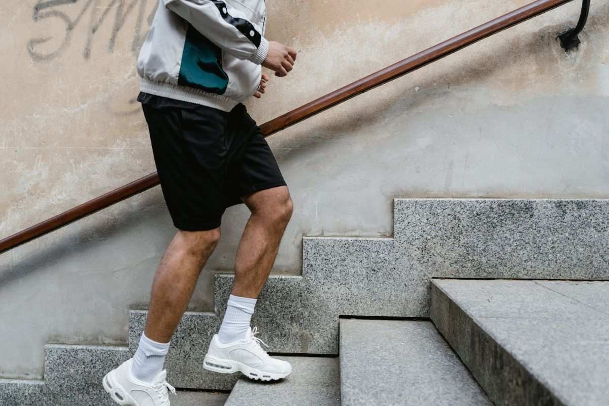 Man running in long running shorts