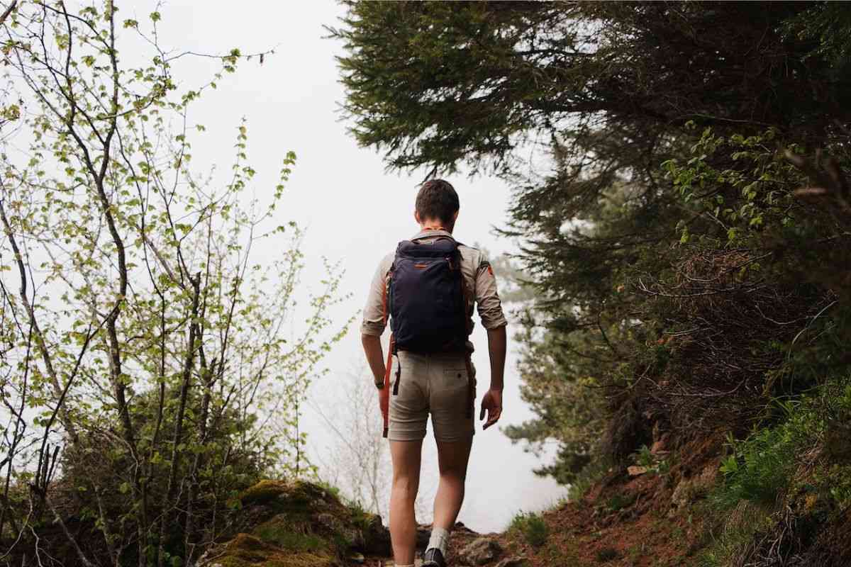 Man hiking with a weighted backpack