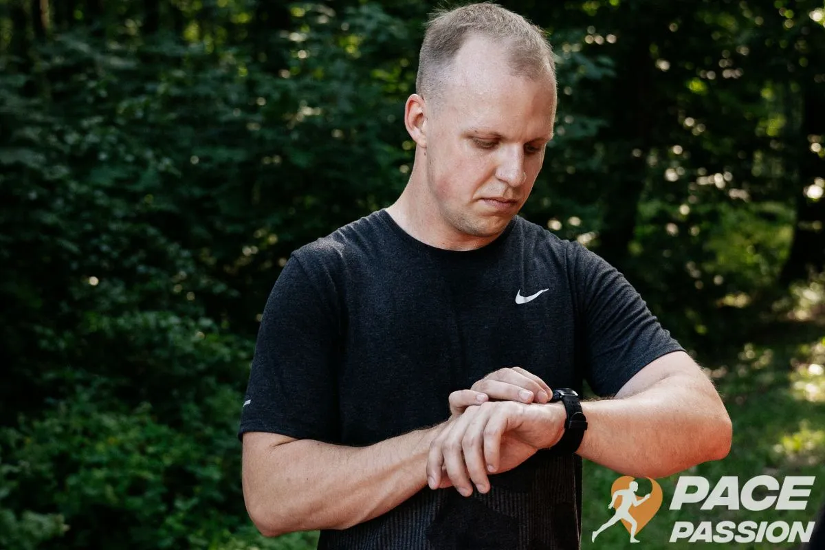 A male runner checks the average time for a good 10K performance