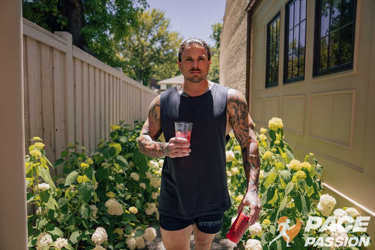 Man taking pre-workout supplements before going for a run