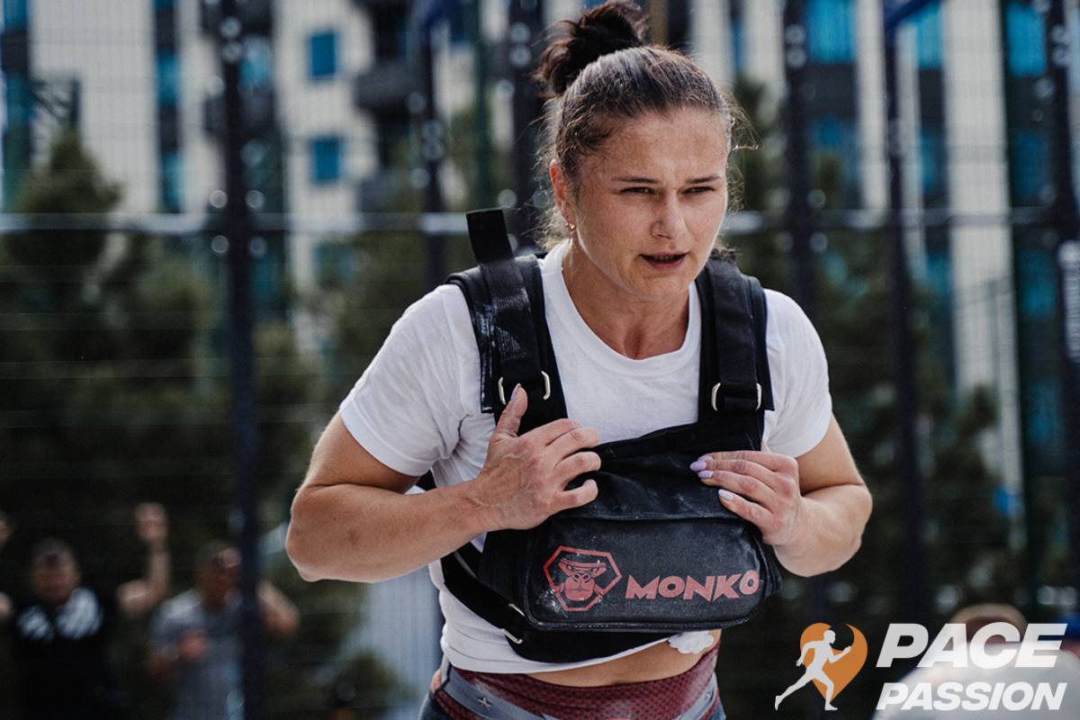 Woman running with a weighted backpack