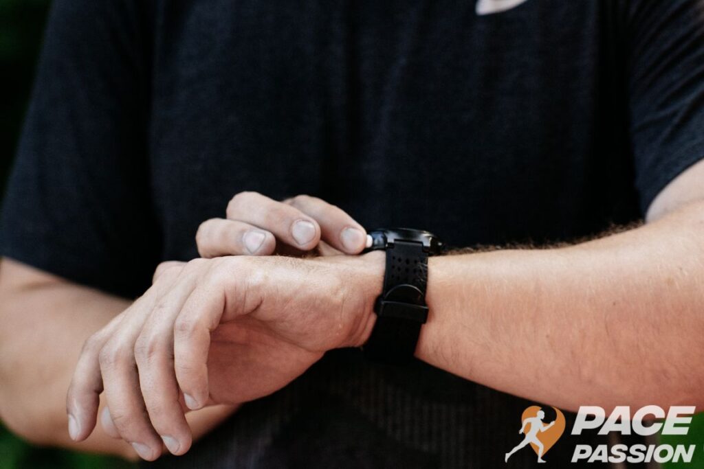 A male runner is tracking his steps during a 2-mile run or walk