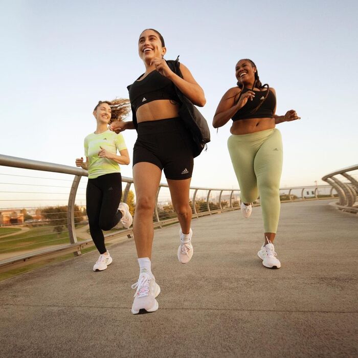 Woman running in Adidas Solarglide 5 shoes