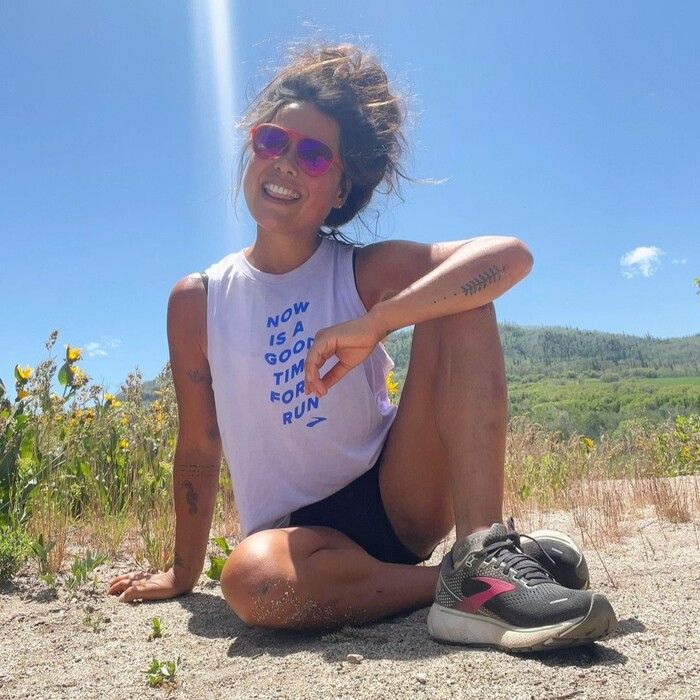 A female in Brooks Ghost 14 running shoes