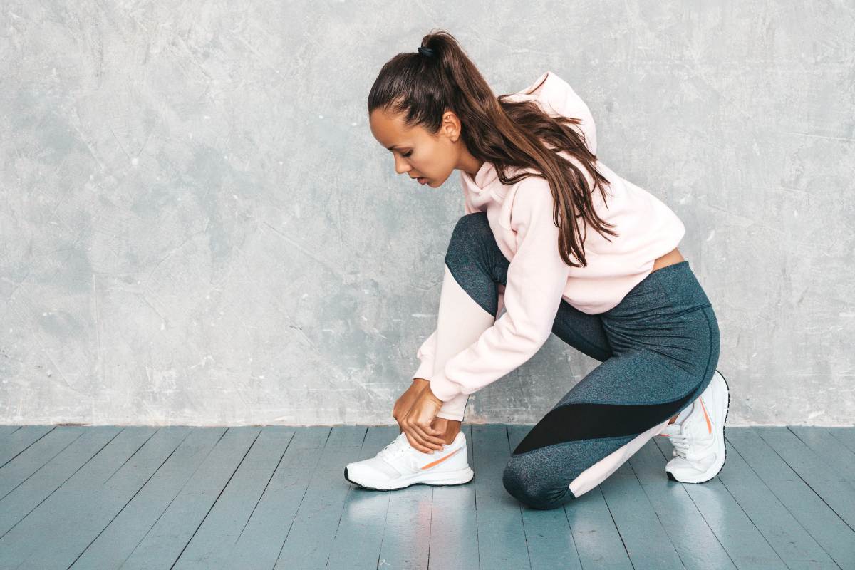 Woman wearing tight running shoes with pointed toes