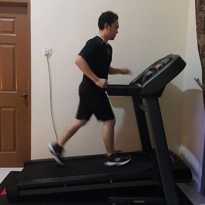 Man running on Horizon Fitness T101 Treadmill