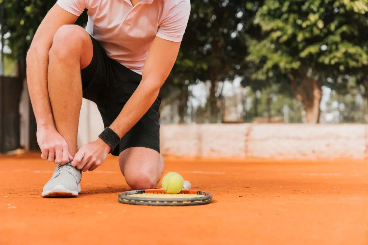Man prepping for a tennis game