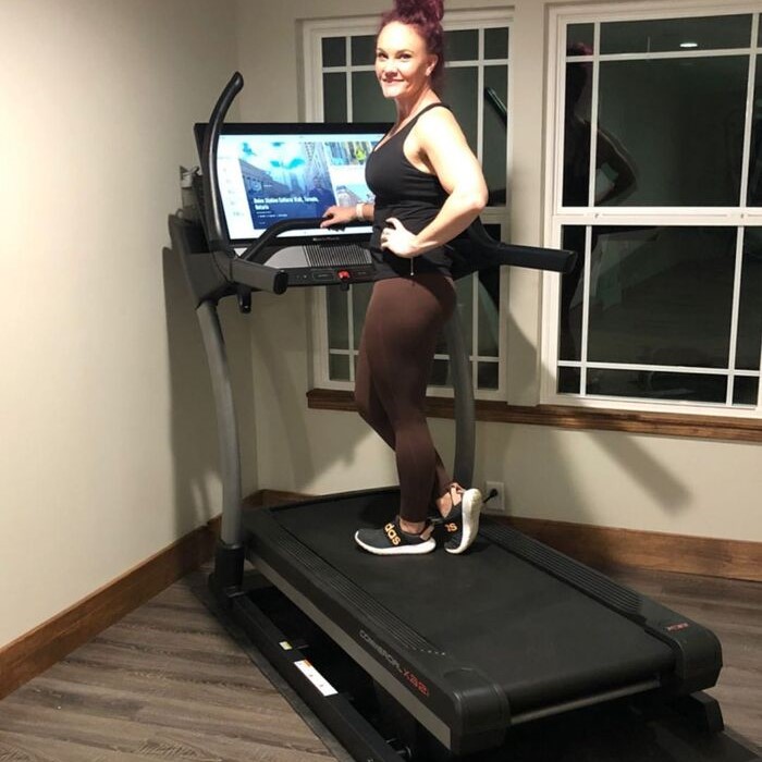 Woman exercising on a NordicTrack treadmill